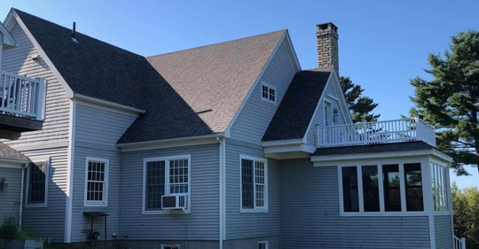 a house with shingle roofing