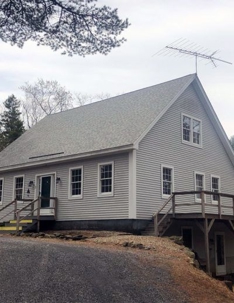 a house with a shingle roof
