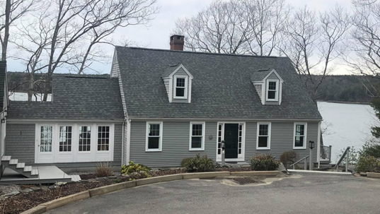 a house with architectural roofing shingles